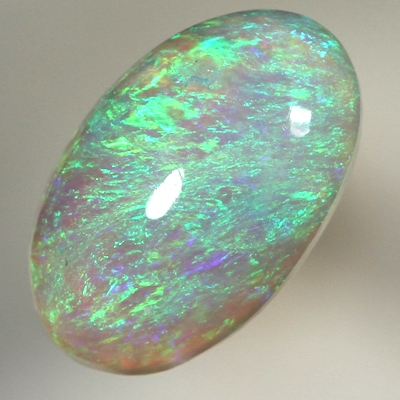 SOLID CRYSTAL OPAL Bright green fire in a 3 dimensional pattern